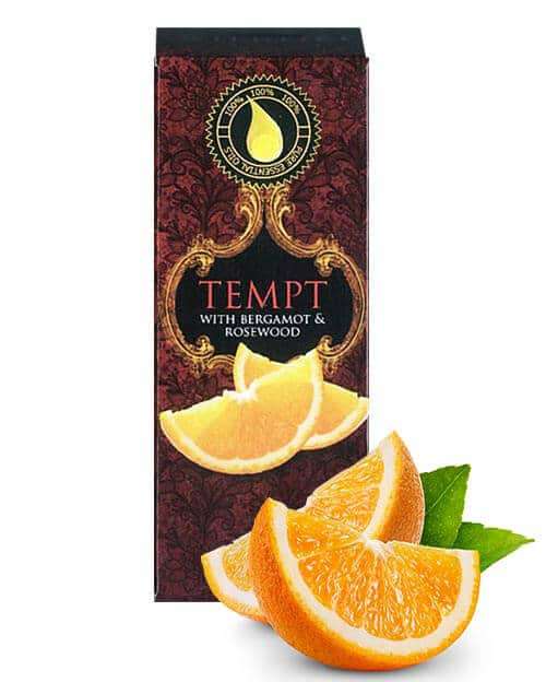 tempt 10ml essential oil box with slice of orange in the foreground