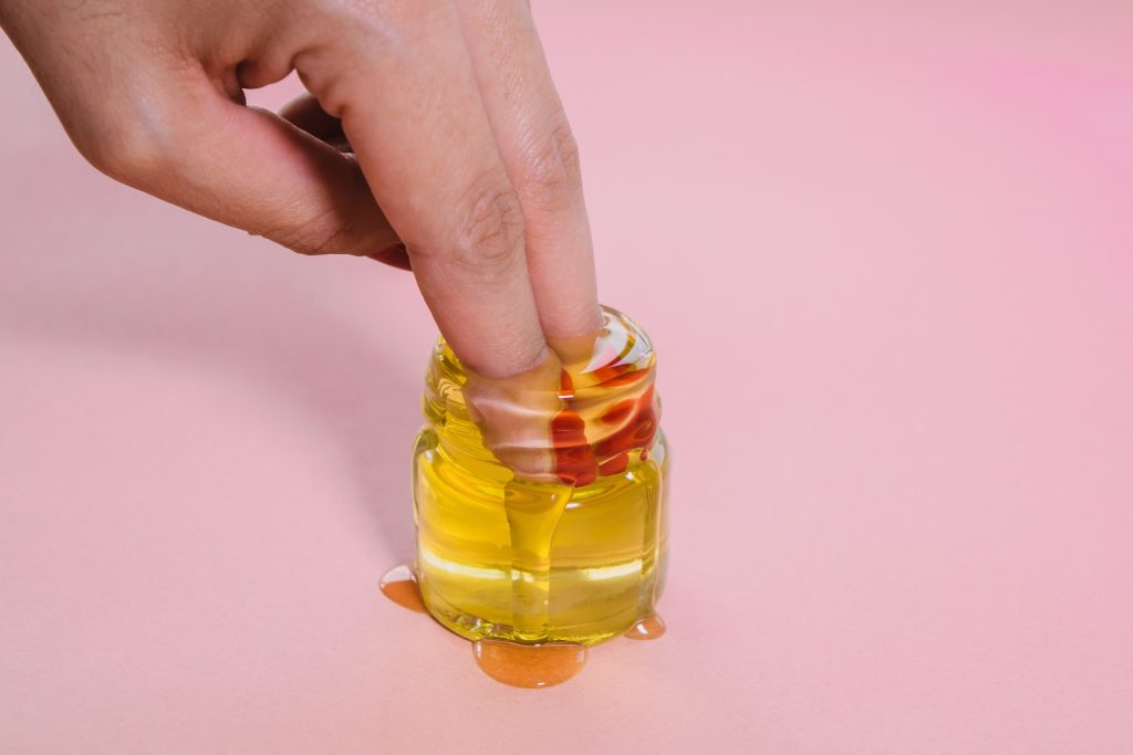 lube-alternatives-fingers-in-jar-of-honey